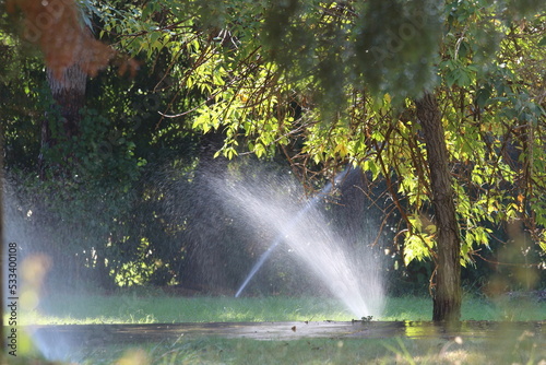 water droplets from water sprinkler of automatic watering. Watering the lawn with an automatic irrigation system.  