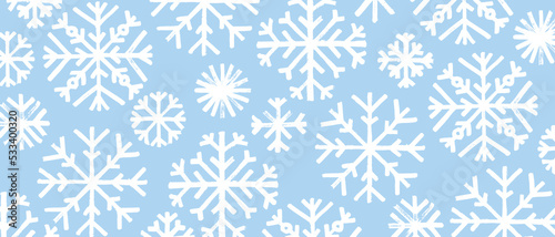 Background with white snoflakes. Winter holiday backdrop.