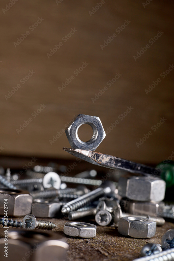 close-up industrial hardware objects on dark background close-up industrial hardware objects on dark background