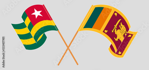 Crossed and waving flags of Togo and Sri Lanka