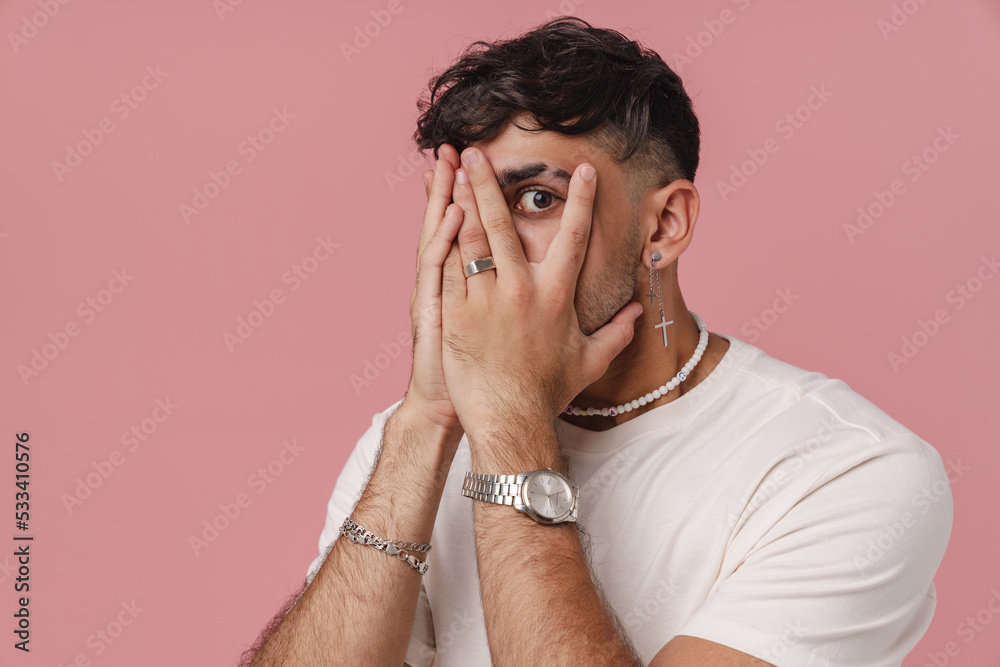 Ταπετσαρία Young stylish man covering his face and peeping between fingers