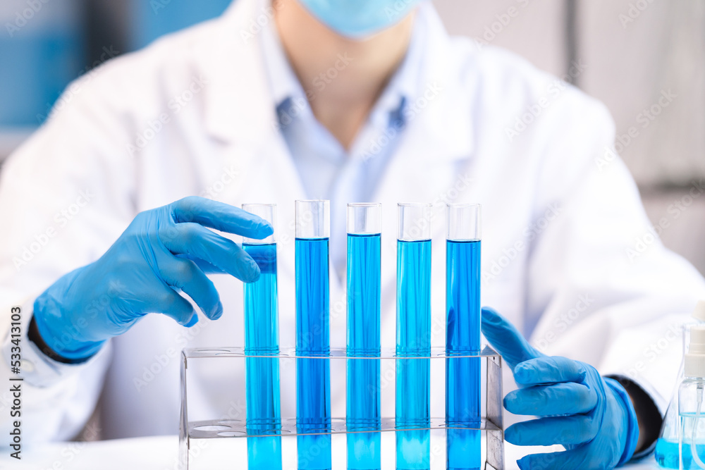 blue chemical liquid experiment in scientific glassware equipment in science medicine laboratory, chemistry or biology research discovery by using glass of test tube or beaker and flask blue chemical liquid experiment in scientific glassware equipment in science medicine laboratory, chemistry or biology research discovery by using glass of test tube or beaker and flask