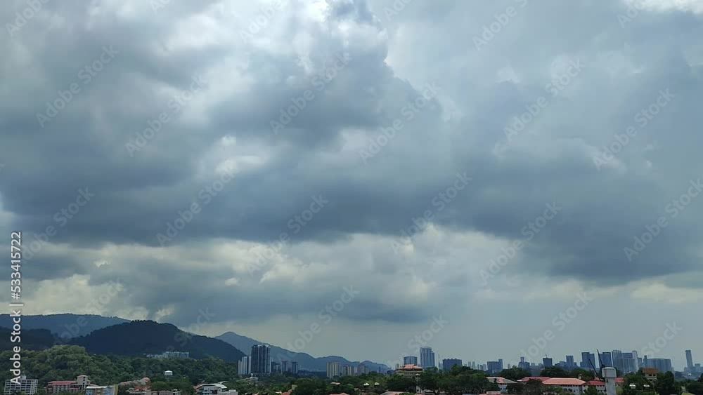 cloudview with gloomy thick clouds, grey sky, cityview
