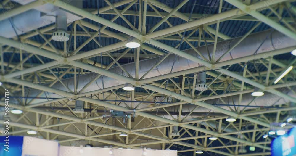 modern technologies.quadrocopter flies inside a large industrial building.close-up. modern technologies.quadrocopter flies inside a large industrial building.close-up.