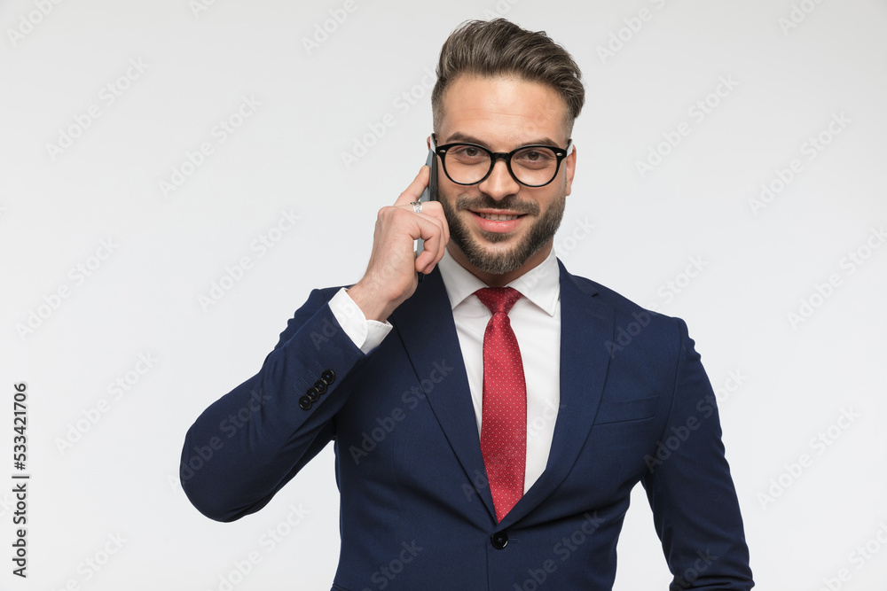 happy businessman with glasses talking on the phone and smiling happy businessman with glasses talking on the phone and smiling