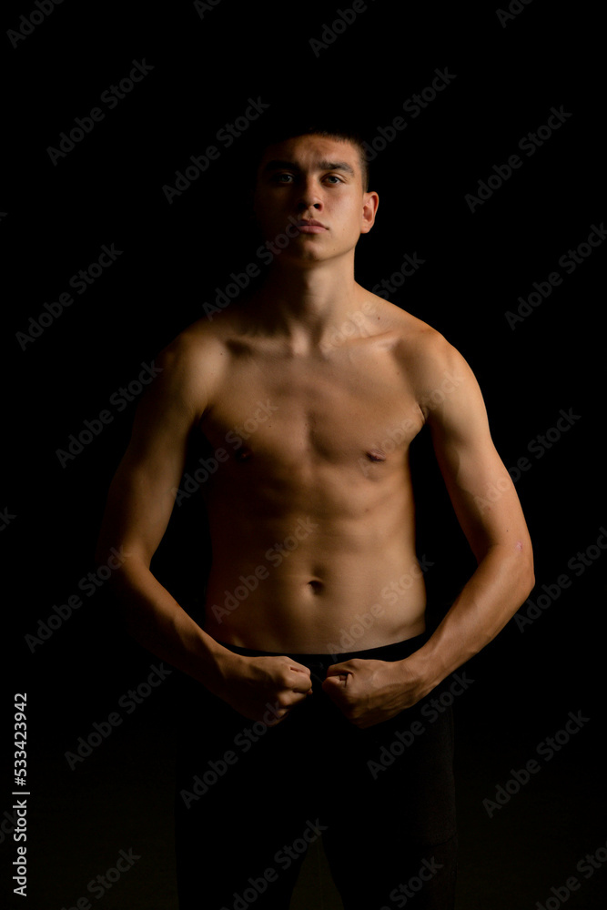 Fototapeta premium Nineteen year old teen boy shirtless portrait