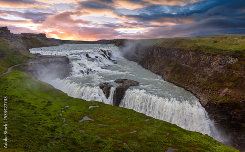 Majestic Gullfos waterfall with picturesque sky during sunset. Amazing nature scenery. Scenic Image of Iceland. Iceland is iconic country for landscape photographers. popular travel destination
