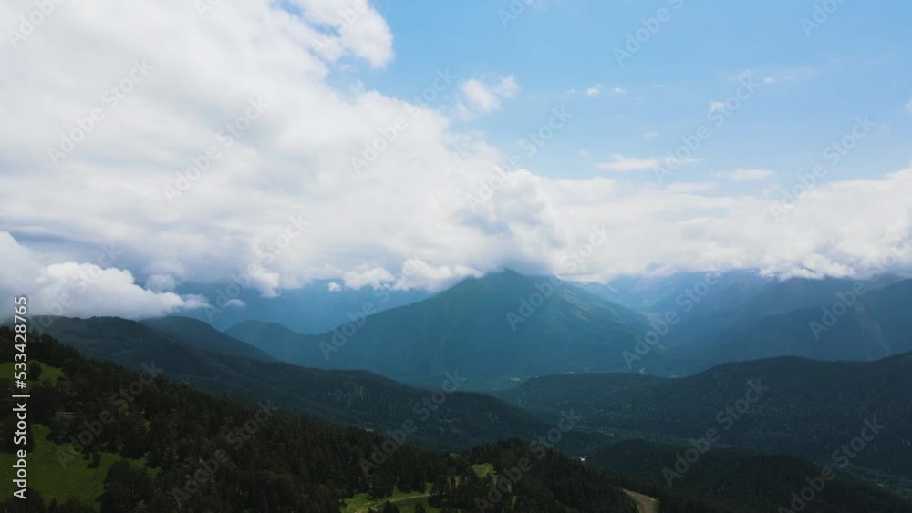 panorama of mountain peaks with clouds in summer in teberda shot on a drone panorama of mountain peaks with clouds in summer in teberda shot on a drone