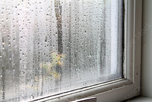 Condensation water on window glass on the inside of the house