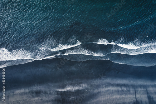 Fototapeta Naklejka Na Ścianę i Meble -  Moody atlantic ocean wave on black sand beach in summer at Iceland