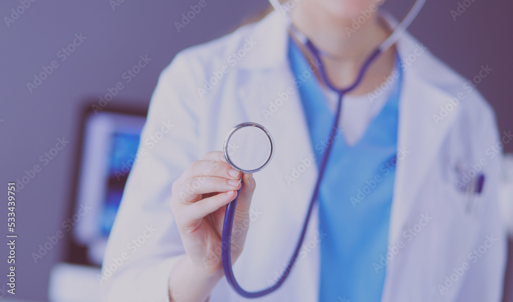 Close-up shot of doctor's hands holding stethoscope at clinic. Close-up shot of doctor's hands holding stethoscope at clinic.