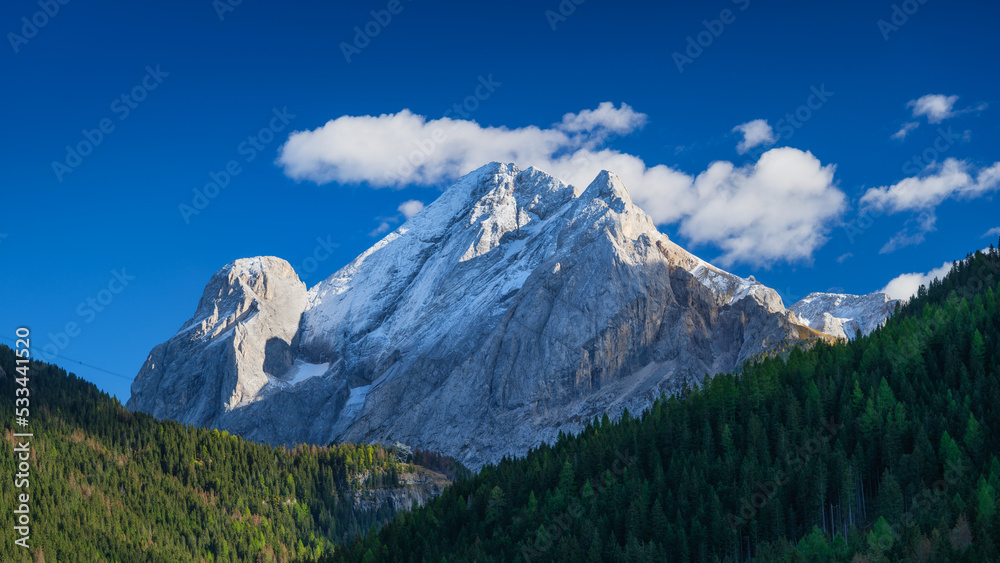 High sharp rocks and forest. Mountain valley at the day time Natural landscape. Landscape in autumn time. Photo in high resolution.