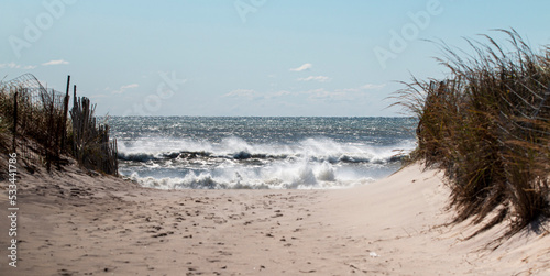 Fototapeta Naklejka Na Ścianę i Meble -  View of walking down the beach with a rough Atlantic Ocean