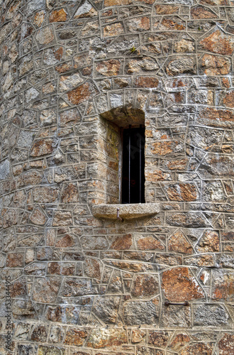 old brick tower wall with window