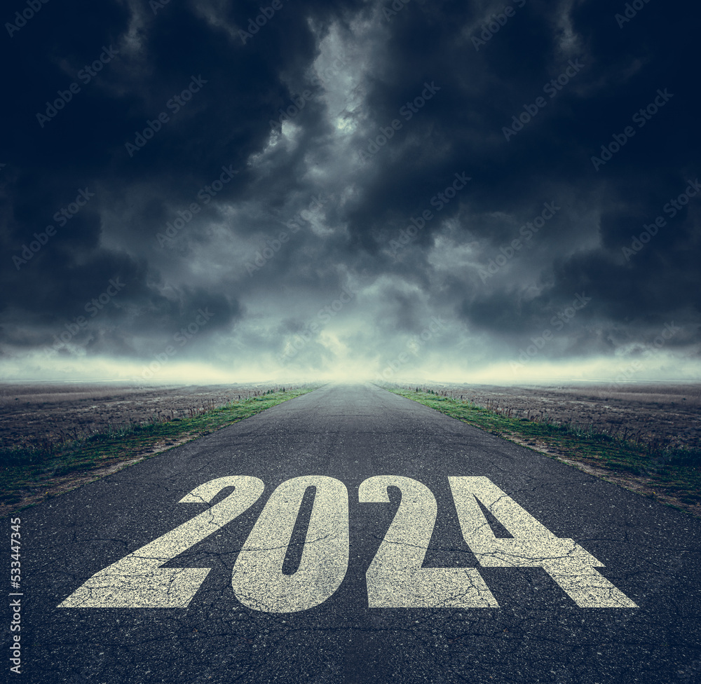 2024 written on highway road in the middle of asphalt road and dark