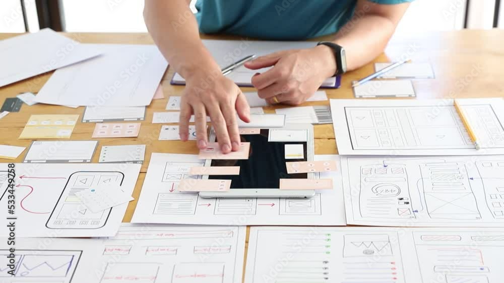 UX UI Concept, Graphic designers work together with UX UI designer planning application template layout framework for mobile phone computer mobile UX UI Concept, Graphic designers work together with UX UI designer planning application template layout framework for mobile phone computer mobile