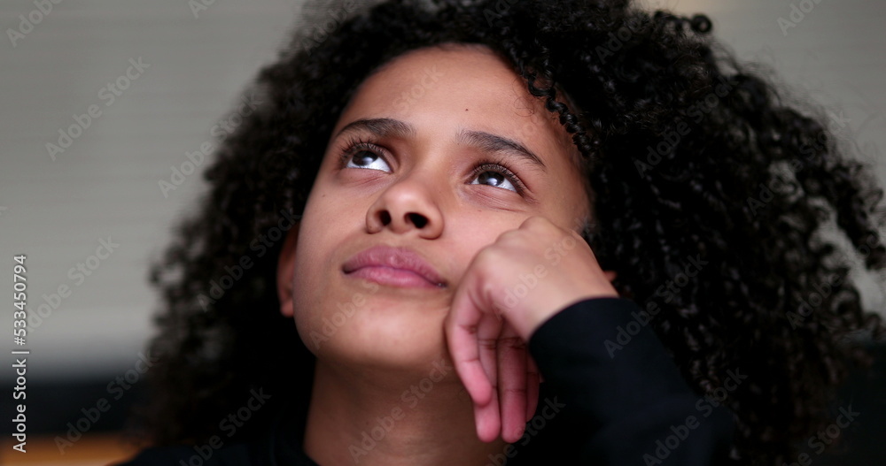 Black little girl thinking pondering problem solving. Thoughtful child Black little girl thinking pondering problem solving. Thoughtful child
