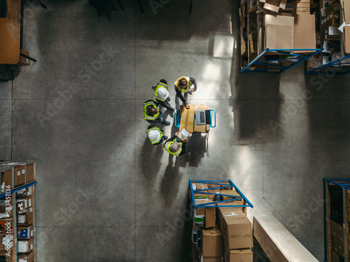 Aerial view of a warehouse team having a staff meeting photo