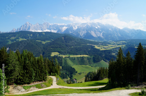 a picturesque mountainous landscape of the Austrian Alps with a hiking trail in the Schladming-Dachstein region (Steiermark or Styria, Austria)