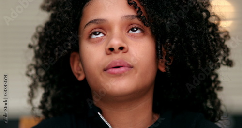 Bored Little girl rolling eyes to sky feeling annoyed eye-rolling