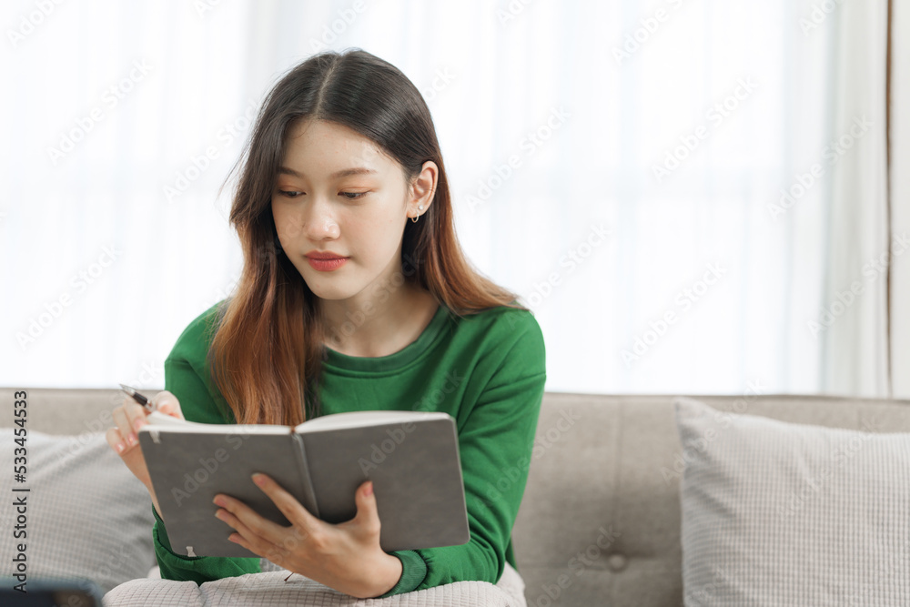 Happy young attractive smiling asian woman enjoying relax time at apartment. Happy young attractive smiling asian woman enjoying relax time at apartment.