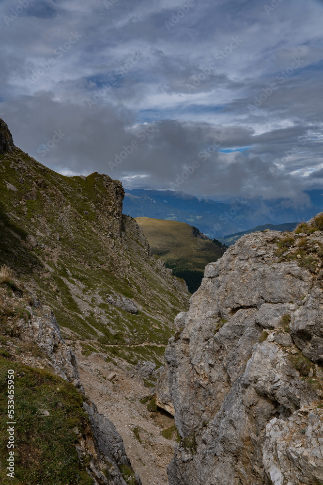 Landscape of the dolomites in the surroundings of Seceda on a cloudy day