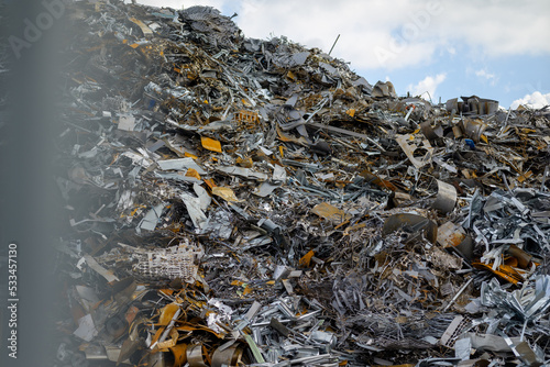 Scrap dealer with a huge mountain of steel