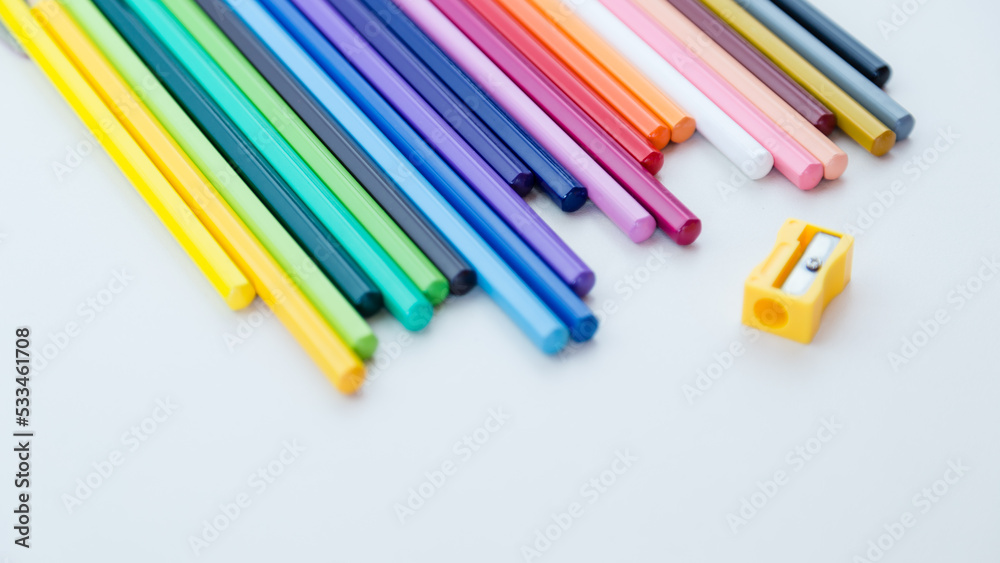 Colored pencil crayons in a row