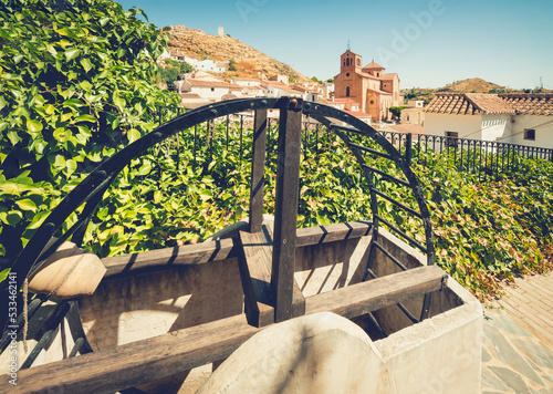 Treadmill or wooden wheel to extract water in tourist photography in the town of Lubrin, Almeria (Spain) photo