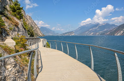 Wallpaper Mural Magnificent modern cycling and walking path along Lake Garda - "Ciclopista del Garda", which offers magnificent views of the lake and mountains. Brescia, Italy. Torontodigital.ca