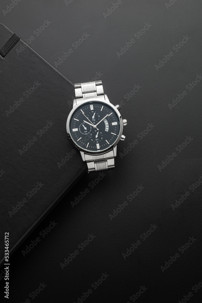 Luxury white chrome watch on black background