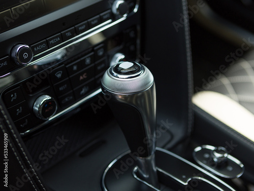 gear shift lever in a powerful modern car © AvokadoStudio