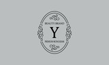 Premium monogram with the letter Y. Frame with ornament. Luxury logo design with minimal modern font.
