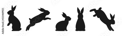 Black silhouettes of easter bunnies isolated on a white background. Vector illustration