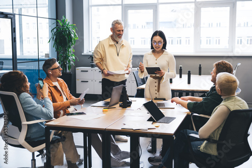 Group of multiethnic coworkers sharing ideas on business project