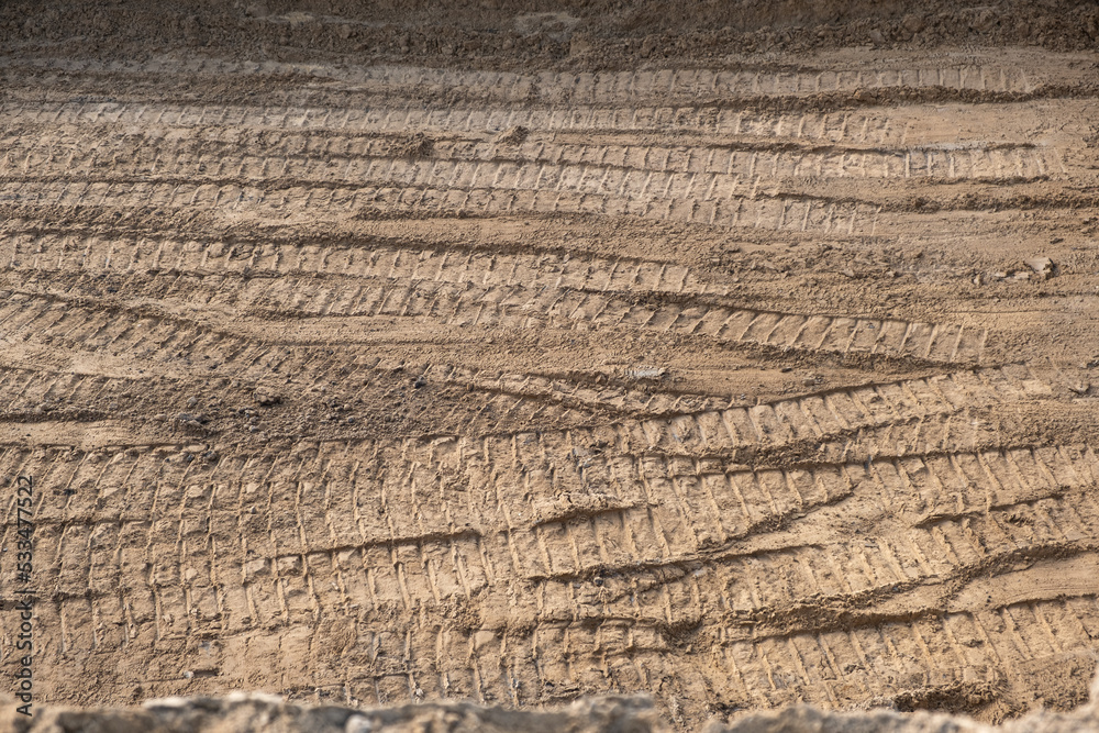 Soil ground, Car tire tracks tire track print on construction site Soil ground, Car tire tracks tire track print on construction site