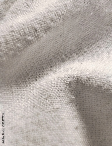 Close up of textured old white fabric