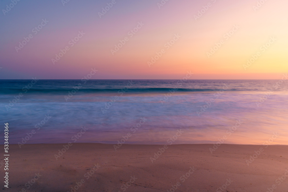 Scenic sunset sky over sea with sandy coast Scenic sunset sky over sea with sandy coast