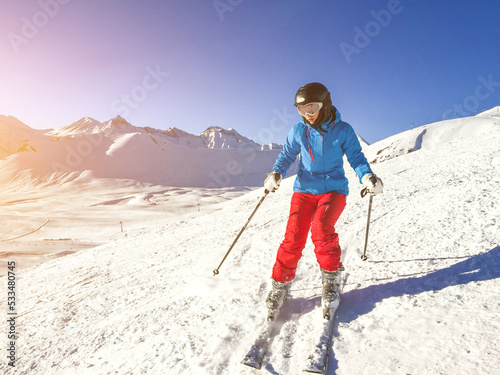 Woman skiing in the mountains photo