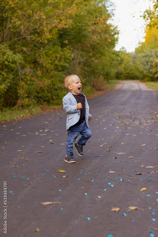 little boy running in the park