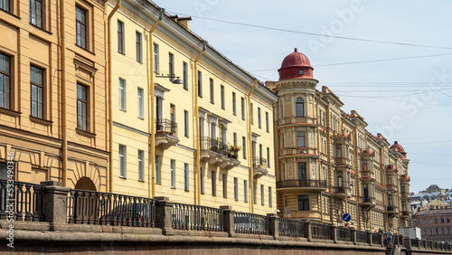 Profitable House of Ratkov-Rozhnov with statues or bas-reliefs of Atlases on embankment of Griboyedov Canal, St. Petersburg, Russia © Olga