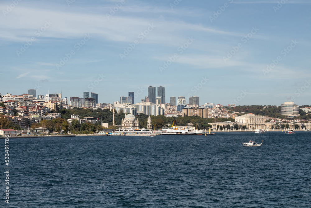 View of boats on Bosphorus, Dolmabahce and Besiktas areas on European side of Istanbul. It is a sunny summer day. View of boats on Bosphorus, Dolmabahce and Besiktas areas on European side of Istanbul. It is a sunny summer day.