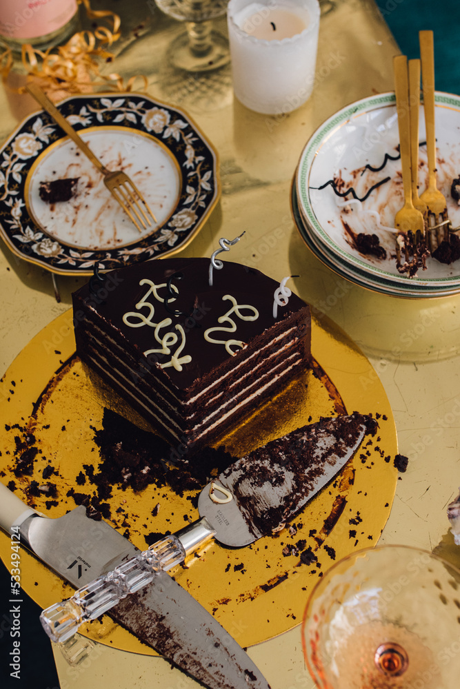 Birthday chocolate cake party celebration mess with plates and forks ...