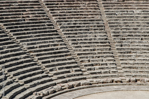Stone seats of an ancient Greek theater in sunny day
