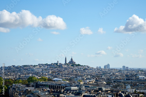 Mont Matte with Sacre Coeur in the middle of Paris, surrounded by buildings photo
