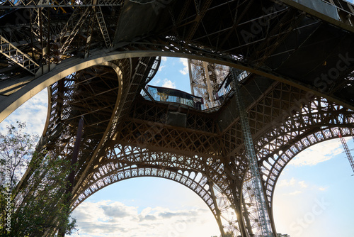 Eiffel Tower from underneath looking up into the beautiful structure and seeing the steel beams © Maximilian Andre
