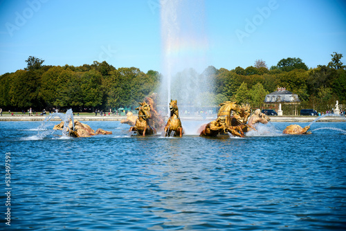 Apollo Fountain in the park of Versailles with a water fountain in the background
