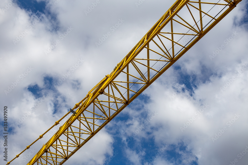 Crane on a job site in São Paulo, Brazil. With blue sky in the background