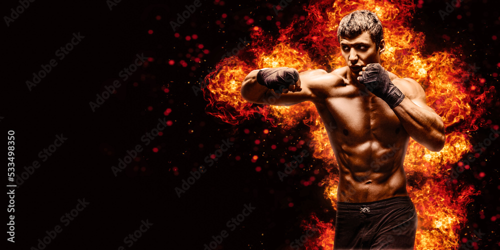 Fighter man punching in fire
