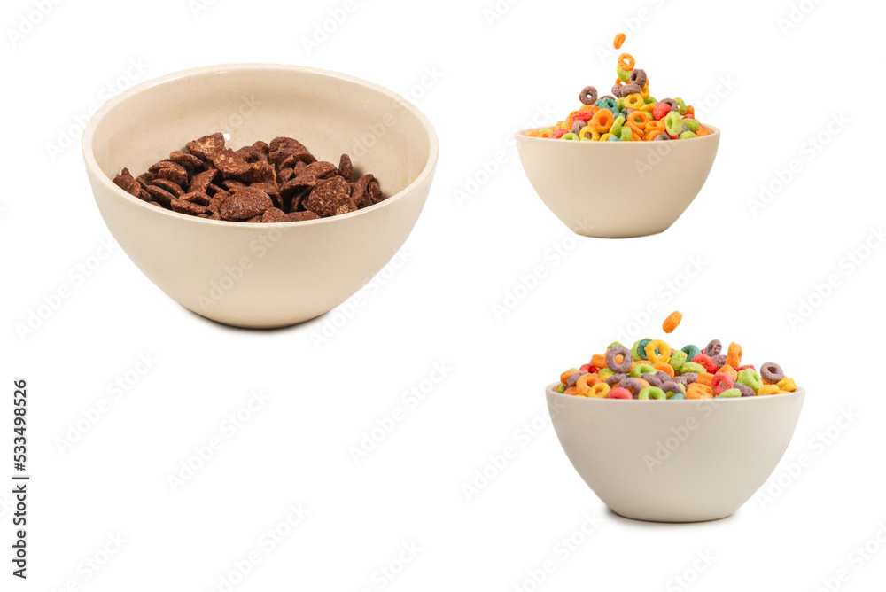Chocolate corn flakes falling to the white bowl isolated on white. Motion. Chocolate corn flakes falling to the white bowl isolated on white. Motion.